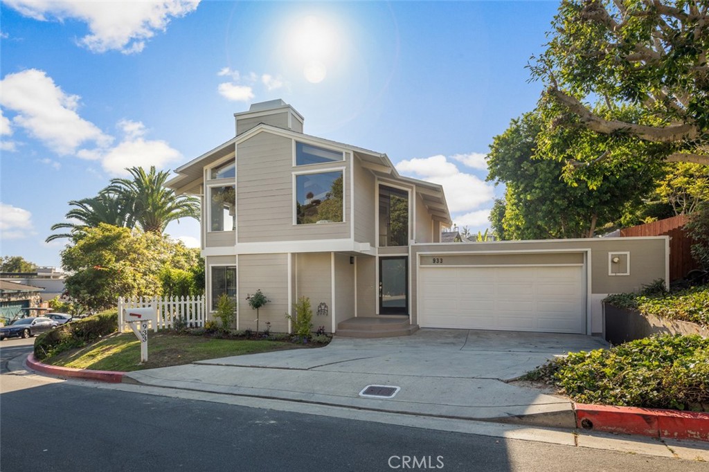 RARE OPPORTUNITY to own your own piece of paradise in the Heart of “LAGUNA VILLAGE” in Laguna Beach. Experience the pinnacle of modern coastal living in this exquisitely renovated 3-bedroom, 2.5 -bathroom sanctuary, where sophisticated design meets unparalleled ocean and hillside vistas. This recently updated 3 bedroom + family room boasts a contemporary blend with modern aesthetics offering a haven of relaxed coastal living at its best. Ideally positioned just moments away from Laguna's renowned beaches, Bluebird park and the prestigious 5-star Montage Resort. Sitting on a premier lot, this updated residence enriched by contemporary architecture is situated on an oversized flat cul-de-sac lot with gorgeous lush landscaping. Walk through the entry steps and prepare to be awed by the multiple windows and high ceilings. The first floor primary main suite is complete with French doors and a private patio overlooking the stunning backyard including three pineapple palm trees. Primary bathroom includes dual sinks, custom cabinets and a large custom tile shower. Generously sized secondary bedrooms complete the main level providing comfort and privacy, complemented by an additional bathroom as well as a direct access hallway slider that opens onto a newly landscaped interior yard with new fence. The second level includes a Sunlit Living/Dining area with a custom floor to ceiling tile fireplace, new blinds as well as French doors which open to the expansive outdoor ocean view deck area, extending the living area and embracing the indoor-outdoor living. The newly upgraded Gourmet Kitchen features quartz counters with a breakfast bar and all new stainless steel appliances. The family room is conveniently located on the second level next to the kitchen and boasts gorgeous ocean views. Also included is an interior Laundry room, 2 Car Garage with lot of cabinets for extra storage as well as a 2 car driveway. The Roof and gutters were replaced in 2023. This residence offers easy access to amenities including renowned restaurants, galleries, the trolley, boutique shops, award winning schools and more. Embrace the epitome of modern coastal living in this exceptional ocean view sanctuary, delivering the finest in Southern California's luxurious lifestyle. This one is Move-in ready and won’t last!