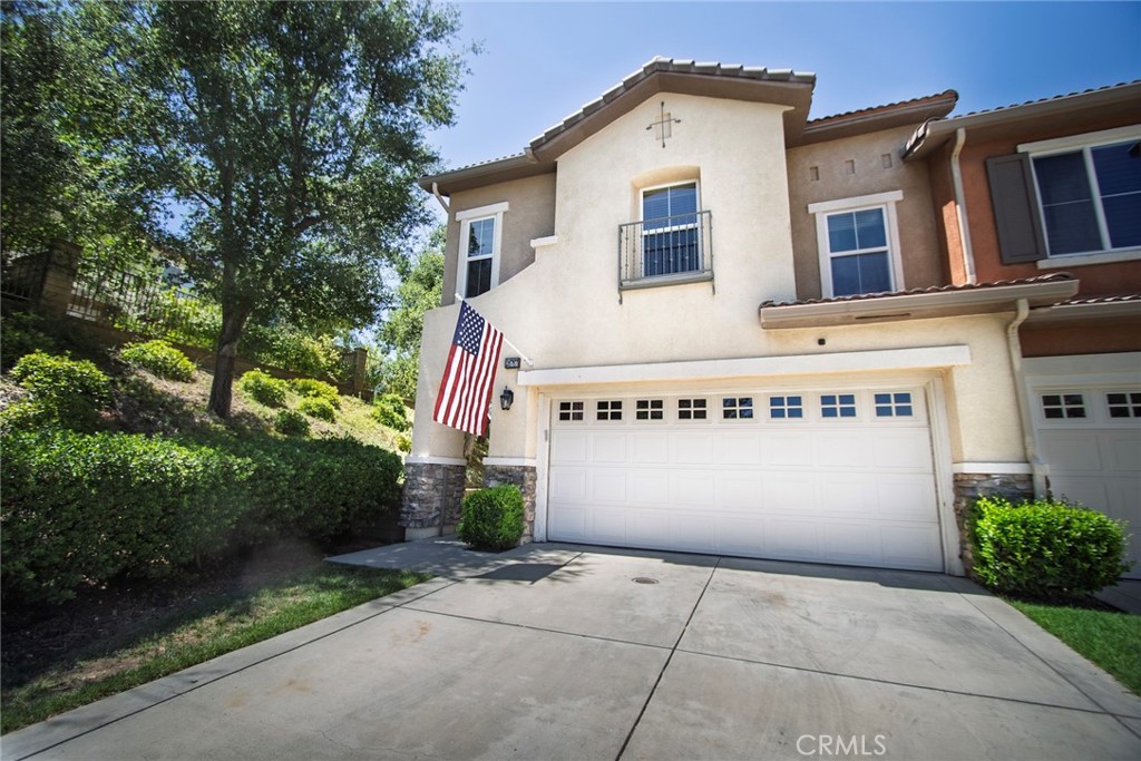 Tucked away on a prime cul-de-sac lot in the prestigious gated community of Westridge – Bella Ventana, this elegant home offers unmatched privacy and a tranquil “woodsy” feel, with no neighbors to the left and lush surroundings, including fruit trees. Step through the gated courtyard and into a beautifully designed floor plan with tasteful upgrades throughout. The fully remodeled kitchen is a showstopper—featuring a large island with custom lighting, a farmhouse sink, updated cabinetry, stainless steel appliances, gorgeous quartz counters, a custom hood, pendant lights, and a stylish butler’s pantry. The kitchen opens to a spacious great room with a cozy fireplace and access to the peaceful backyard, making it perfect for entertaining or simply relaxing. Just off the entry, a charming portico nook provides an ideal home office setup. Upstairs, a bright loft offers additional space for a sitting area or workspace. The primary suite is a true retreat with its own sitting room, fireplace, and private balcony. The en-suite bath has been completely remodeled with a custom walk-in shower, dual vanities, luxury vinyl flooring, and a spacious walk-in closet. Two additional upstairs bedrooms are generously sized, filled with natural light, and share a full hall bath. An extra alcove provides space for a craft station or homework area. Throughout the home, you’ll find plantation shutters solar and wood blinds, tile and engineered wood flooring downstairs, and carpet upstairs. The garage features lots of built in cabinets for stroage. The community itself offers a clubhouse with a pool, spa, sports courts, recreation center, and nearby parks. Conveniently located near top-rated schools, shopping, and freeway access, this beautifully remodeled home offers elegance, privacy, and a lifestyle of comfort behind the gates of one of the area’s most sought-after neighborhoods.