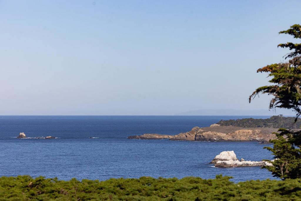 Compelling ocean views unfold in this unique, magical Carmel Highlands home in an exceptional coastal enclave. A tapestry of tree, sea, stone, and star, here a select curve of coastline offers an artistic mix: modern and vintage homes dotted among gems by internationally-acclaimed architects from Charles Sumner Greene to Wallace Cunningham. On a private, rare 1-acre on the west side of that ribbon of roadway threading the Big Sur coast, this is one of few located on the ocean side, in an exclusive handful of properties wrapped within iconic Spindrift road. Strategically sited on its elevated acre, the interior is bright and airy. Soaring ceilings and windows frame unobstructed ocean views visible from every room. Awake to intimate views of the headlands of Point Lobos; granite glows in rising sun, enhanced by the sapphire sea. Whitewater unfurls over satellite rocks off the mainland. Private but not isolated, 2 minutes to Pacific's Edge dining at Highlands Inn, 5 miles to Carmel, enjoy proximity to cultural events there and adjacent Pebble Beach. Carmel Highlands has long attracted some of the world's great creatives, tech types, and Hollywood A-listers seeking sublime spirit of place. Here's your opportunity to join this distinctive enclave, where nature and nurture entwine.