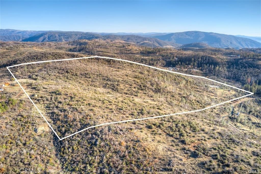 MOTIVATED SELLER! GREAT LAND BUYING OPPORTUNITY. Large scale parcel of land! 60+/- acres rolling over the foothills at the base of the Sierra Nevada Mountains, just up from the Sacramento Valley. Plenty of space to spread out and make your own. Right about 0.36+/- of a mile up off paved road below. 2 wells, seller unsure of current usability and productivity. A near blank slate ready for your creative mindset. Good sized pad areas cleared years ago. Multiple potential pad locations. Some awesome views of the surrounding mountains, Sacramento Valley below & open skies for miles! Zoned FR40. Surrounded by other large parcels. Lake Oroville & Lime Saddle Marina a short drive down from this property. Seller may consider OWNER FINANCING this property with LARGE down; SUBMIT OFFER FOR SELLER CONSIDERATION. Great opportunity for someone with a mindset and a vision. Must make appointment with agent. NO TRESPASSING WITHOUT APPOINTMENT! Seller says, bring offers. Refer to agent remarks in MLS.