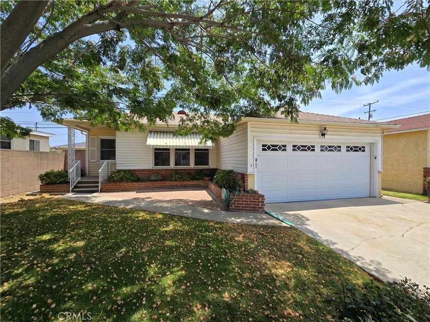 PRIME LOCATION!!  Well kept 2 bedroom 1 bath in very desirable Lakewood neighborhood.  Minor cosmetic fixer but when they say Good Bones, they were talking about homes like this!  Plenty of natural light illuminates this 875 sq ft of living space with an enclosed patio off the rear of the home for added comfort.  Vinyl windows throughout the home.  Gorgeous wooden floors!  Entryway flows into a spacious living and dining room area.  Large kitchen with ample counter and cabinet space.  Off the kitchen we have a separated laundry room with utility sink that leads into a roughly 11' x 22' enclosed patio!  Large Two Car garage with 220v option!!!  Backyard has large concrete slab, making it a nice blank canvas for your ideal backyard set up.  Sprinklers are in place for all of the landscaping on the property.  This family friendly community is just a short walk from the LBX shopping and dining center.  Centrally located providing easy access to all major freeways. Home is being sold as is.  This property is the ultimate minor-fixer starter home, let's make it your new home today!!!