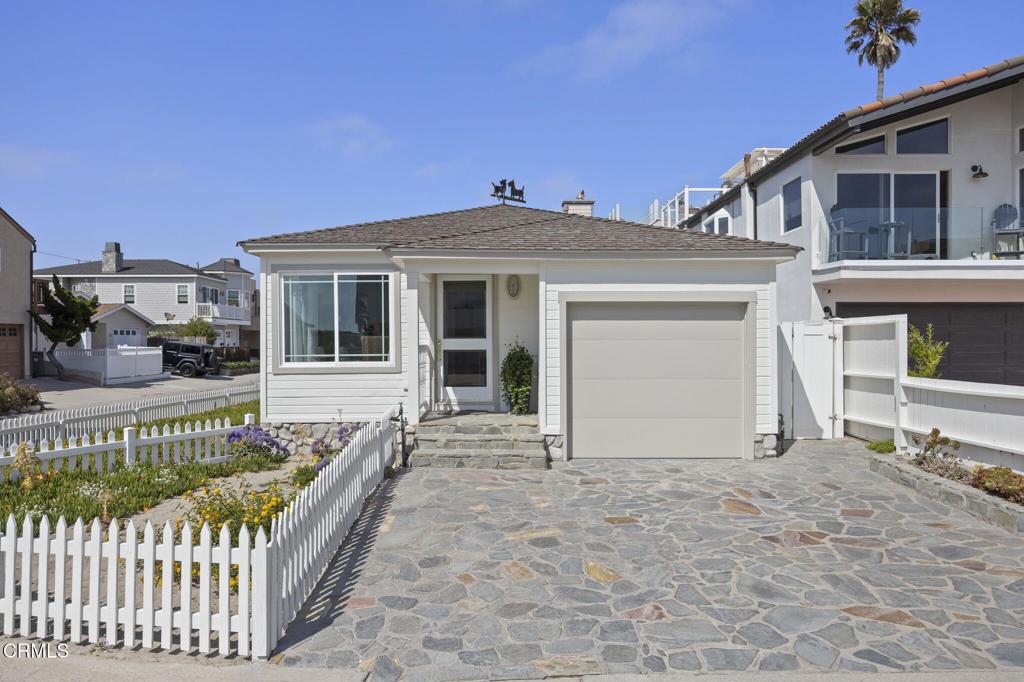 Charming Silver Strand Beach CottageLocated in the highly sought-after mid-beach section of Silver Strand, this delightful cottage sits on a prime corner lot just steps from the sand. Surrounded by white picket fencing and brimming with coastal charm, this home captures the essence of beachside living.Step inside to discover original hardwood floors, fresh interior paint, and classic shiplap walls that enhance the cottage's timeless appeal. The gourmet kitchen is a standout feature, boasting a 48' Wolfe range, granite countertops, custom cabinetry, and a Sub-Zero refrigerator--a chef's dream in a cozy beach setting.Offering 2 bedrooms and 1.5 bathrooms, along with a 1-car garage, this home is ideal for weekend escapes or full-time beach living. With its easy access to the ocean just across the street, you'll enjoy the sounds of the waves and daily beach strolls right from your doorstep.Come and discover the beauty of Silver Strand--a true coastal gem where charm, location, and lifestyle meet.
