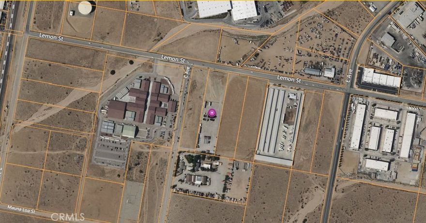 Large Commercial Lot that is partially fenced. Perfect for developing storage units, parking for a trucking company, or whatever you can imagine.
