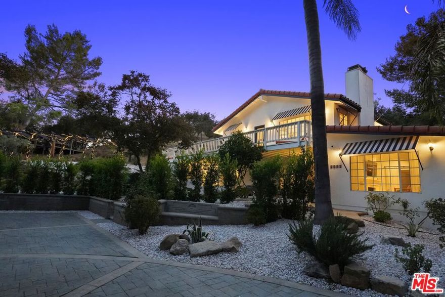 MASSIVE PRICE REDUCTION!! Seller will consider all offers. Peace and tranquility permeate every aspect of this stylish, newly reimagined Mediterranean home. Strategically placed deep in the heart of Old Topanga, where life seems to move at a slightly slower pace, this custom home was built on over an acre of usable land, with room for expansion and possible access from the top. The main floor entry with outdoor lounge spaces and porches & patios off every room, creates easy indoor/outdoor flow, for Topanga living at its finest! Here you'll find a well-appointed kitchen, stylish navy blue dining room and a living room complete with cozy fireplace that opens up to an additional patio in the back. Laundry room has direct access, with board storage convenietly located just outside the door, allowing you to return from catching some waves without tracking sand thru the house en route to the beautiful new guest bathroom complete with Brazilian quartzite walk-in shower with rain head and heated towel bar. Upstairs you'll feel like you're sleeping in a tree house in the generously sized primary suite with fireplace, private bath with soaking tub and walk-in shower, double vanities and direct access outside. There is also a large walk-in closet, and huge wraparound deck with cross canyon views, creating multiple spaces to relax and restore. Luxe safari themed guest bathroom and two additional bedrooms complete the 2nd floor, where a whimsical jungle nursery is the perfect place for your little one to begin his/her Topanga Story. Both back bedrooms have large sliding doors, each opening onto the yoga/meditaion deck and outdoor work out room. The yard beyond beckons, creating that amazing connection to nature we're all hoping for in Topanga. Newly planted privacy hedges and beautiful new xeriscape with succulents and 10 mature fruit trees and roses provide a low maintenance, drought tolerant dream garden. Paths and walkways connect the different areas of the property including an enclosed veggie garden/chicken coop, picnic area, arbor, hidden trampoline for fine tuning your acrobat skills and there's plenty of raw land for expansion. This home is located just down the road from the Summit to Summit with access to miles and miles of hiking, biking and equestrian trails. The property also has great parking, with a pass-through driveway, and sits street to street with an additional entrance possible to the upper portion of the lot, offering an amazing opportunity to build a second dwelling up behind the house with cross canyon views. Conveniently located close to Calabasas schools and shopping, and still just a short jaunt to town and the beach.