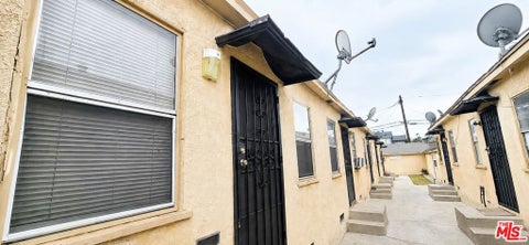 Photo of 10620 S Figueroa Street #1/4, Los Angeles, CA 90003 (MLS # 26864057)