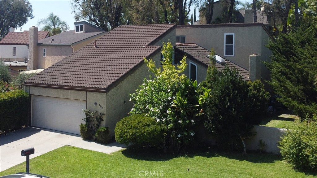 Huge potential in this 5-bedroom, 3-bathroom, 2-story Mission Viejo home in Aegean Heights. Walk in to a large family room with vaulted ceilings, adjacent to a formal dining room that connects to an open-concept kitchen with brand new cabinets (2025), breakfast bar with 3 stools, and a spacious breakfast area with lounge sofas and a coffee table. 1 bedroom, 1 bathroom downstairs. Upstairs is a primary bedroom with double-door entry, vaulted ceilings, and dual-sinks in the primary bathroom. 3 spacious bedrooms, and 1 hallway bathroom + a nook at the top of the stairs complete the second level of this move-in ready home. Enjoy the HOA community pool, tennis, and picnic area just a short walk up the street. Bring your paint and style to make this wonderful opportunity your perfect home.