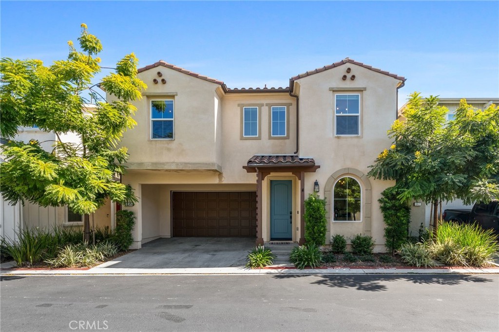 Welcome to 945 Brilliance Lane — a modern 4-bedroom, 2-bath home with a versatile bonus room, built in 2018 and perfectly located in the vibrant Elara neighborhood of Costa Mesa. Offering 2,447 sq. ft. of thoughtfully designed living space and an attached 2-car garage, this home combines contemporary style, comfort, and convenience. Step inside to soaring ceilings and an abundance of natural light, creating a bright, airy atmosphere. The open-concept living area flows seamlessly into the sleek kitchen, where a large island serves as the heart of the home — ideal for cooking, entertaining, and everyday life. A downstairs office provides a quiet space for remote work or a cozy reading nook. Upstairs, the spacious primary suite is a true retreat, featuring two walk-in closets, dual sinks and a spa-like walk-in shower. You’ll also find an oversized laundry room that makes daily chores effortless. Notable features include a whole-home water softener, water filtration system, and thoughtful built-in storage solutions.
The backyard offers low-maintenance beauty with Spanish tile and artificial turf, creating a charming outdoor space perfect for kids, pets, and gatherings. Enjoy a short walk to local breweries, as well as The Camp and The Lab, where you’ll find unique dining, coffee shops, and boutique shopping. The neighborhood’s small park and play area add to its welcoming, community feel. You’re also just minutes from John Wayne Airport, South Coast Plaza, and easy freeway access. Don’t miss your chance to call 945 Brilliance Lane home — a stylish, newer build in one of Costa Mesa’s most walkable and connected locations.