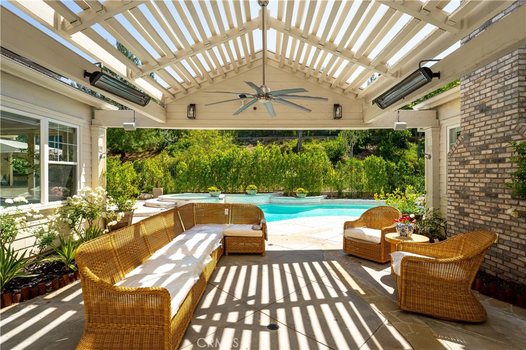 Step into elegance with this stunning Robinson Ranch residence featuring 4 generously sized bedrooms and 4.5 bathrooms across a well-designed, open layout. This home showcases rich hardwood flooring and a newly designed custom kitchen with premium appliances, dual sinks, a double oven, and a spacious center island that seamlessly connects to the inviting family room-perfect for everyday living and entertaining.
Enjoy a formal dining area, a welcoming living room, an oversized laundry room, and abundant pantry storage.
Upstairs, discover a thoughtfully planned layout with an office and a library positioned on opposite ends for added privacy and function.
The entertainer's backyard is your personal retreat-complete with a saltwater pool, spa, built-in BBQ, and outdoor dining area, ideal for enjoying Southern California living year-round *Owner Occupied/Please do not disturb homeowner*