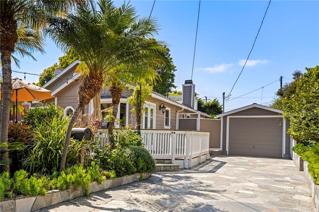 Nestled in the heart of the Laguna Village, this 1940 Beach cottage offers a quintessential Laguna lifestyle. Just steps from the iconic Laguna Beaches, your new home is the perfect get away where you can start your day with the morning sun warming your face on the front deck and enjoy dinner in the evenings.
Inside, the cottage blends charm and comfort. The updated interior has custom "Laguna" wood siding and Pella windows and a fireplace in the living room. Your private primary bedroom has double doors the open to the back yard, its own fireplace and roomy bath with heated floors & walk in shower. The thoughtful design extends outdoors with a bonus room, separate laundry room and storage for you beach gear, boards and wetsuits. In the rear yard you have a covered outdoor kitchen, including a bar, grill, sink, perfect for entertaining and you can head up to the roof top deck to enjoy the evening lights and peek ocean views. Off street parking for two cars.
Living in Laguna Village means you're in the center of everything with boutique shops, quaint cafes, surf shops, and a bustling arts scene at your doorstep. This classic Laguna cottage offers a unique blend of coastal living and village charm. Embrace the Laguna Beach lifestyle where every day feels like a vacation.