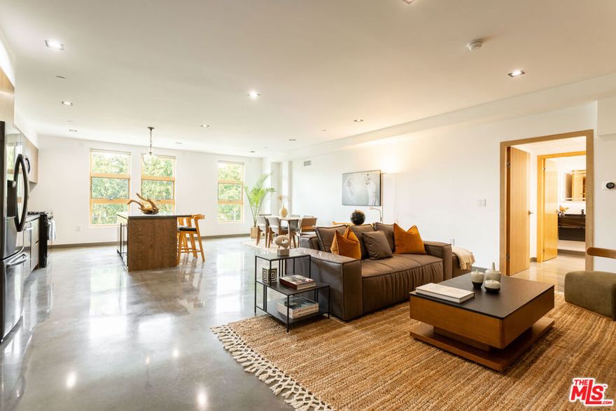 Making its debut in one of West Hollywood/Beverly Grove's most coveted locations, 547 Sweetzer is a brand-new construction contemporary building bringing modern design, elevated amenities, and boutique-quality living to the neighborhood. This spacious 2 bedroom, 2.5 bathroom residence showcases polished concrete floors, oversized windows with remote-control power shades, Nest-controlled central heat and air, and an open-concept layout with a sleek kitchen outfitted with brand-new appliances. Both bedrooms are private suites with spa-inspired bathrooms, complemented by a stylish powder room and thoughtful storage throughout. Residents enjoy an expansive rooftop sundeck with sweeping city views, a 24-hour camera security system, and a gated subterranean garage with two side-by-side parking spaces plus a private storage unit. Available furnished or unfurnished, this home blends modern luxury with everyday convenience-just steps from Melrose Place, West 3rd Street, and Beverly Boulevard's premier dining, cafes, and boutiques.