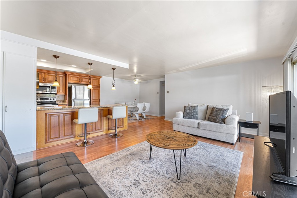 Welcome to this beautifully upgraded second-floor 2-bedroom, 2-bath condo—with no one above for added peace and privacy. Enjoy a spacious open floor plan designed for comfortable everyday living and effortless entertaining.
Inside, you’ll find freshly painted interiors, smooth ceilings, and laminate flooring throughout—no carpet in sight. The fully remodeled kitchen opens to the living area and features granite countertops, soft-close cabinetry, stainless steel appliances, pendant lighting, and recessed lighting for a modern touch.
Step outside to an oversized balcony accessible from both the living room and guest bedroom—the perfect spot for morning coffee or evening relaxation. Both bathrooms are updated with granite countertops, tile flooring, and contemporary fixtures. Additional features include mirrored closet doors, in-unit dishwasher and garbage disposal, and central air conditioning.
This unit comes with a covered carport (with storage) just steps away and ample guest parking directly in front. Ideally situated in a quiet, private location within the community.
Community Highlights:
Laguna Woods Village is an exclusive 55+ gated community offering resort-style amenities, including a 27-hole championship golf course, 9-hole executive course, five swimming pools, tennis and pickleball courts, fitness centers, horse stables, seven clubhouses, over 200 social clubs, and a performing arts theater.
Residents also enjoy added conveniences such as water, trash service, and local transportation—covered through HOA dues.