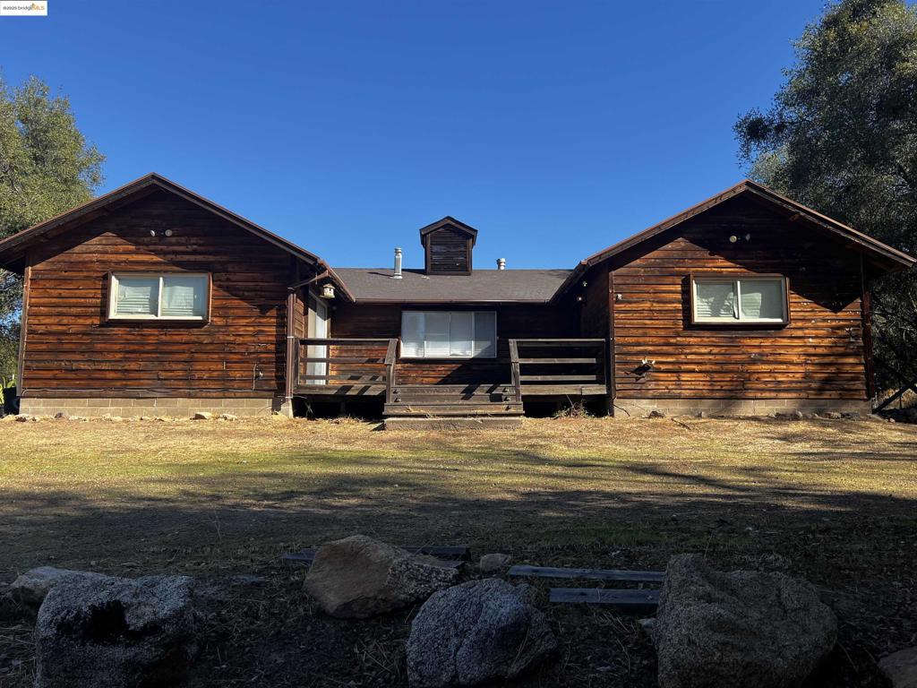 Gold Country Living!! This 2 Bedroom 1.5 bathroom is both affordable and practical. Nestled on a quiet 6.5-acre premium lot, this property provides extreme privacy and breath-taking views of the Yosemite foothills. Cozy up in the formal living room while relaxing next to the wood burning stove. Enjoy eat-in style kitchen with plenty of cabinet and counter space. Both bedrooms are good size with full closets and ceiling fans. Entirely separate washroom with tons of storage. Absolute stunning sunrise and sunset views surrounding the entire property! Backside of property set up for fruit trees and garden with large vegetable boxes and automatic irrigation. A gentle small walk from the back of the house to very large greenhouse that sits perfectly in a beautiful and quiet meadow. Very serine!!! Securely store all your mowers, boat, and recreational items in the large detached 3-car garage. ATV type trails on property. Private double gates. Located just a quick 15 minutes from the historical town of Mariposa, restaurants, grocery, entertainment, and a really nice Starbucks! 45 minutes to Yosemite National Park entrance. FYI- Optional 6.6-acre, buildable lot directly across the street being sold separately by same owner! (4320 Usona Rd) Ask agent for details.