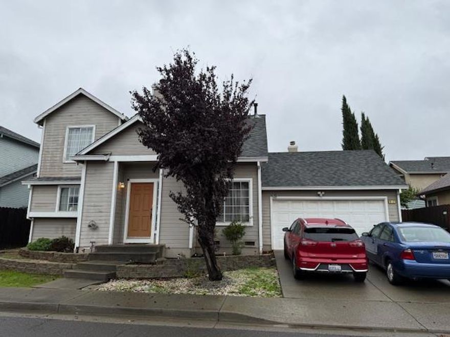 Great home for first time buyers. Custom designer's paint, counter tiles, patio, fruit trees, Pergo flooring in living room and kitchen. Master bedroom downstairs with oval tub and walk-in closet. Third bedroom is a loft.