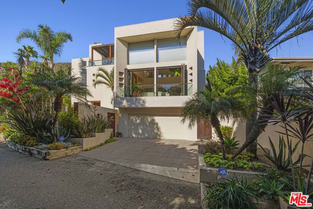 Welcome to 31851 Seafield Drive, an exquisite multi-level architectural home nestled in one of Malibu's most coveted coastal enclaves. Just steps from the sand, this stunning residence blends modern sophistication with serene, retreat-style living. Offered at $19,500/month for an 18-month lease.The dramatic two-story living room showcases soaring ceilings and floor-to-ceiling glass, flooding the space with natural light and framing ocean views.This 4-bedroom, 3.5-bath home features a spectacular two-level primary suite with dual fireplaces, a steam shower, and direct access to a private rooftop sun deck with a jacuzzi the perfect spot to sip morning coffee with ocean views or unwind beneath the stars.Additional highlights include lush, professionally landscaped grounds with a tranquil waterfall and fountain, creating a peaceful, private oasis. A flexible floor plan offers a potential maid's suite adjacent to the two-car garage.Best of all, enjoy private access to Broad Beach, just steps from your door.Experience the best of Malibu coastal living in this one-of-a-kind architectural masterpiece.