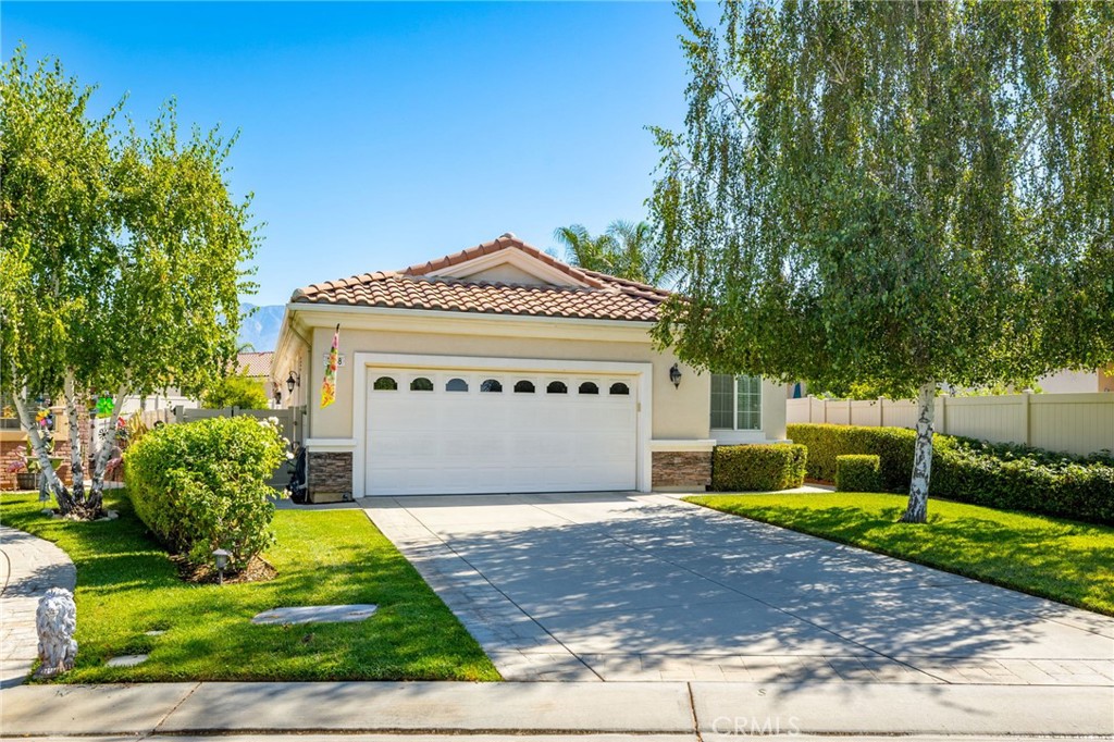 From the moment you walk into this beautifully appointed home, you quickly realize the you've found a perfect blend of comfort, elegance, and thoughtful design. This 1392 square foot "Princess" floor plan in a 55+ active adult community features 2 bedrooms, 2 bath, spacious kitchen, living room, dining room and an extra room that could be designated as an office, den or hobby room. The stunning kitchen outfitted with gorgeous granite counter tops and back-splash, stainless steel Samsung appliances, and oversized pantry will soon be the gathering place for entertaining, blending style and functionality. An amazing dining and living room with ceiling fan and attractive lighting fixture flow from the kitchen allowing an effortless connection for everyday living. Step into the peaceful primary suite with walk-in closet, a picture window that invites in abundant of natural light, and a spacious bath that features a beautiful vanity with double sinks, granite counter tops, and a shower surrounded by glass. The guest bathroom is equally polished and situated next to the guest bedroom for added convenience. An added bonus is the third room that offers flexibility for any purpose you may need. An ideally positioned laundry room sits adjacent to the garage, and provides a large utility sink outlined with granite. This stylish home boasts laminate flooring, ceiling fans, and recessed LED lighting through-out, offering a seamless look that is both modern and practical. Step into the roomy garage and you immediately notice the epoxy flooring, designed for easy maintenance, durability, and long-lasting protection. The superb backyard features effortless outdoor living on one of the largest lots in Solera, ready for an organic garden, relaxing by the firepit on a fall evening or enjoying football on the patio with an outdoor flat-screen TV and aluma wood patio cover. With the home security system already paid in full, you'll enjoy the added peace of mind. Retirement living in this Del Webb community awaits the active 55+ adult with all of the wonderful amenities, such as a clubhouse with jogging track, fitness center, library, swimming pool, spa, tennis courts and bocce ball to name a few. This splendid home is now available for viewing, come take a look today!