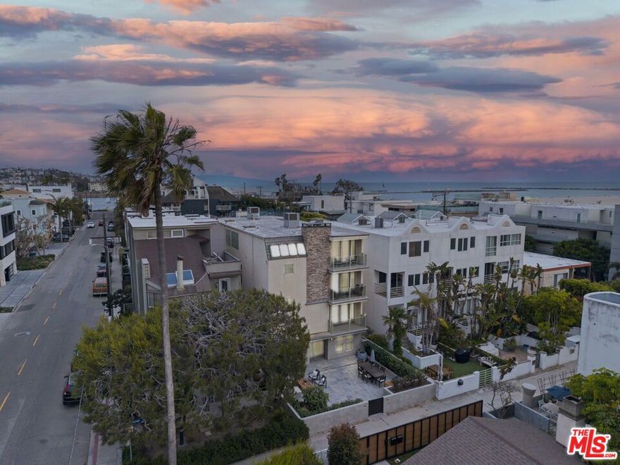 Spectacular main channel townhome just seconds away from the sand on a quiet Marina del Rey "walk street". Located in an exclusive two-unit building, this light-filled 3-story contemporary residence offers 3 bedrooms and 3.5 baths, including a loft-style den/office as the third bedroom. Soaring ceilings and abundant natural light elevate the main living area, while the open-concept kitchen set above the living space features Viking appliances, soapstone counters, and maple cabinetry. A convenient elevator from the lobby opens directly into the main living and dining level. Internal stairs connect to the loft, elevated kitchen, and lower bedroom floors, creating ideal separation for live/work lifestyles and entertaining. The spacious primary suite includes a fireplace, spa tub, dual vanity, and private balcony. The junior suite also enjoys a private spa-style bath and ample closet space. Additional highlights include bamboo flooring, built-in sound system, Phantom screens, generous storage, and two shared guest parking spaces. The cooperative, self-managed HOA emphasizes shared responsibility and collaboration between both unit owners.