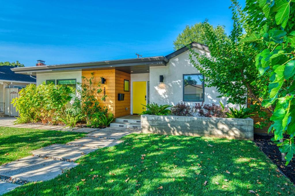 Located just minutes from vibrant downtown Willow Glen, this beautifully renovated single-story home offers modern comfort, versatile living, and income potential all on a quiet, tree-lined street. The main home (1,792 sq. ft.) features an elegant chefs kitchen with top-of-the-line appliances, quartz countertops and generous storage, all designed for both style and function; a light filled dining/family room with a cozy fireplace; 4 bedrooms and 3 full baths, including a serene primary suite with vaulted ceiling, walk-in closet, and spa-inspired bathroom. Hardwood floors flow throughout, and dual zone heating and cooling ensure year-round comfort. The permitted ADU (365 sq. ft.), above the detached garage, has its own private address (2059-B Jonathan Avenue). It offers a full kitchen, bathroom and a washer/dryer., perfect for extended family, guests, or rental income. The detached finished garage creates an excellent bonus space for a home gym, kids playroom, or creative studio. Adorable, landscaped backyard with patio area is great for relaxing or entertaining. Front yard has apricot, fig, plum and peach trees. Just a stroll to the charming cafes, restaurants, and boutiques in downtown Willow Glen, with easy access to major commute routes. Top neighborhood schools.