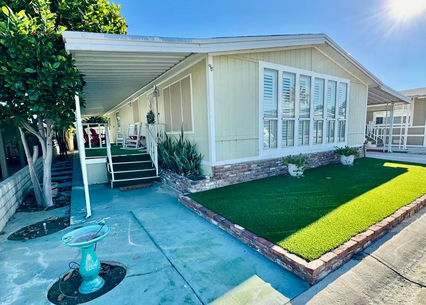 Rancho Casitas is a 55+ Gated Community, you own the land. This home sits on a permanent foundation (433A Certified) Bright and Open Living and Dining room with lots of storage. Built in wall unit with wet bar. Energy efficient shutters help with temperature control on all main living area windows. Kitchen has large pantry. Enjoy your morning coffee at the breakfast bar open to the cozy kitchen. Large laundry room with built in desk. Primary bedroom with plush carpeting. Primary bath has large soaking tub separate from the corner shower. Large hall bath with tub your grandkids.  Comfy guest bedroom for when the kids visit. Outside is maintenance free! Concrete throughout with two sheds! Mature lemon and pomegranate trees. Plus a surprise fruit tree in front!! Come take a look!