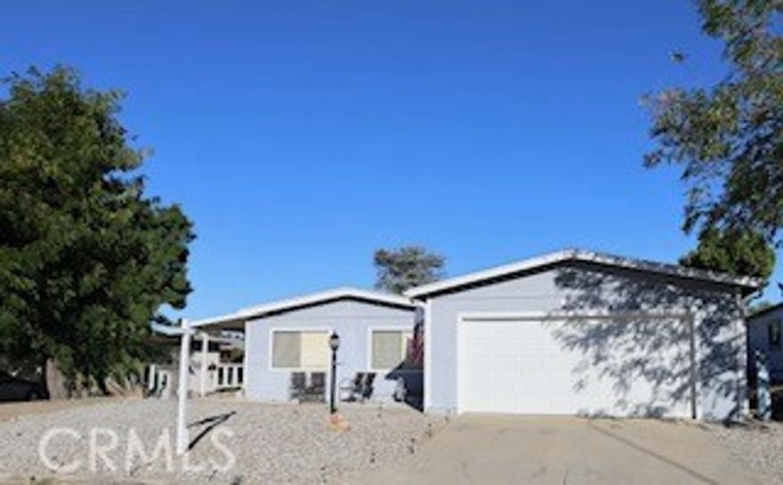 Beautiful manufactured home on permanent foundation is the perfect country charmer in The Farm, nestled on a quiet cul-de-sac street with wonderful curb appeal, mature shade trees, a covered side patio perfect for relaxing in the evening breeze, and an oversized garage large enough to fit a boat. This charming home offers numerous updates, including new plumbing throughout, newer roof, AC system is about five years old; the ductwork was also updated: NEST system, Ring camera at front door, and new gutters. Inside, you'll find a brand new kitchen with stylish cabinetry with quartz countertops; new dishwasher, remodeled bathrooms, and a spacious open layout ideal for entertaining. The dining room is perfect for hosting intimate dinners. The primary suite features a large closet and updated bath, while the secondary bedroom is generously sized. Additional highlights include newer flooring and dual-pane windows; the hallway, laundry, and pantry area are freshly painted; there is a separate laundry area. The backyard provides a great space for gatherings with plenty of room to garden or relax under the shaded trees with wood fencing.  Move-in ready and full of charm - this one is a must-see!