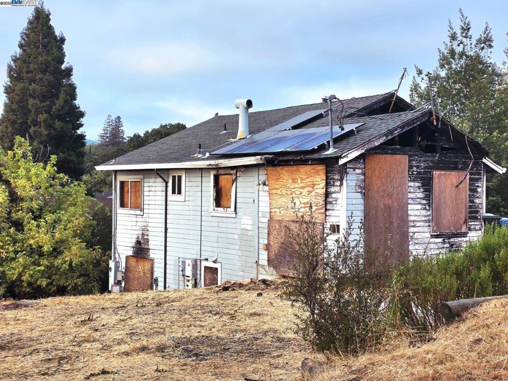 FIRE DAMAGE- This is a prime opportunity for investors or builders to unlock significant value—whether redeveloping into multiple units, building a custom estate, or creating a modern home with yard space. Positioned on the Martinez hills with scenic views of the city and surrounding hills, this property presents a rare redevelopment opportunity in a charming neighborhood. While the existing home has suffered fire damage, the large lot offers flexible potential. It may accommodate construction of two residences buyer to confirm or verify with city planning. The neighborhood offers hillside privacy while being close to downtown Martinez, the marina, trails, local parks, and top schools. With Hwy 4, I-680, and BART nearby, this location blends lifestyle and convenience.