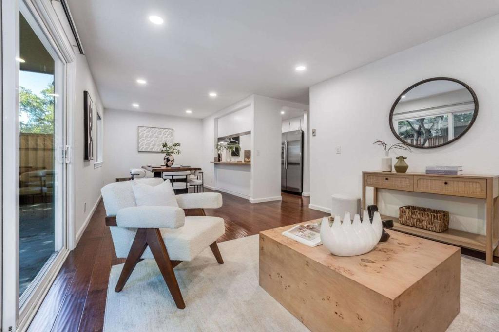 This tastefully upgraded ground-floor unit boasts a bright, open great room with a large living area, dining space, an open kitchen and new double-pain windows and sliding door. It offers two spacious, light-filled bedrooms and a good size bathroom. The living room extends to a generous private patio, ideal for outdoor enjoyment. Community amenities include a pool, clubhouse, and playground. This home's prime location is unbeatable: walk to Vargas Elementary, Whisman Park, and Stevens Creek Trail. A quick 10-minute bike ride connects you to Downtown Mountain View's shops, restaurants, farmers market, and Caltrain. Enjoy easy commutes throughout Silicon Valley, including San Jose, SF, and just a 10-minute drive to SJC Airport.