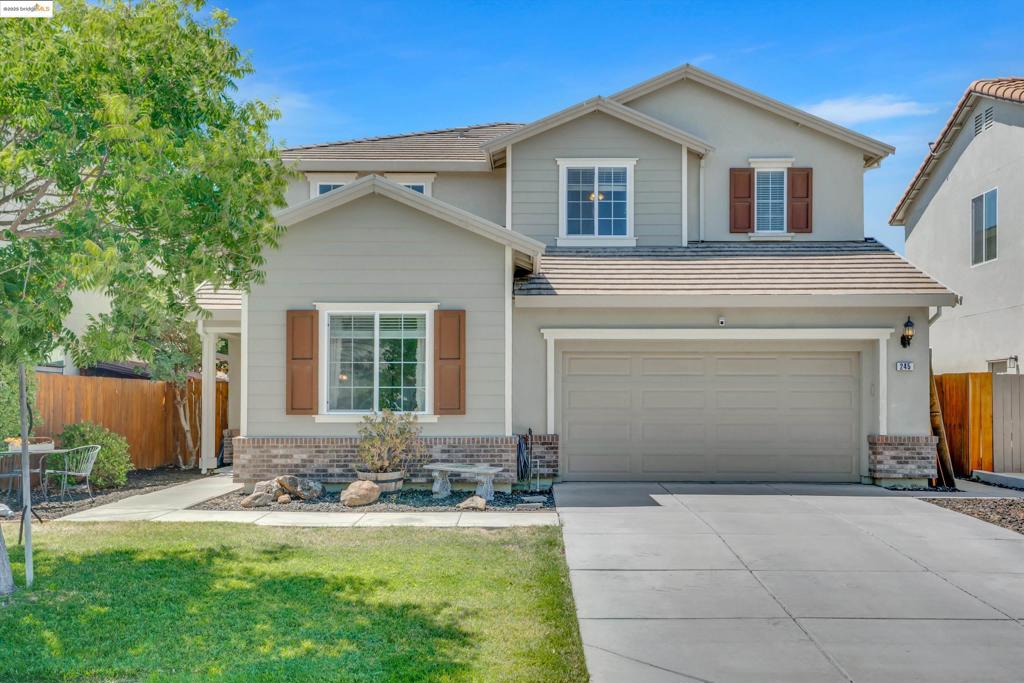 Tucked into a quiet, established neighborhood in Oakley, this is the kind of home where memories are made. This spacious 4-bedroom, 3-bathroom residence blends comfort, functionality, and charm with a layout that fits real life. Celebrate birthdays in the backyard, host holiday dinners in the open-concept kitchen, or enjoy slow Sunday mornings on the porch—this home is the perfect backdrop for every moment. Inside, you’ll find soaring ceilings and inviting spaces to gather or unwind. The formal living and dining rooms flow into a cozy family room. The kitchen features granite countertops, ample cabinetry, and an island perfect for everyday life. A full bedroom and bath downstairs offer flexibility for guests or a home office. Upstairs, the primary suite includes large dual closets, and a spa-like bath with soaking tub. The private backyard features a patio, garden, and no rear neighbors—ready for summer fun! Complete with a 3-car garage and indoor laundry. Located minutes from parks, top-rated schools, shopping, and Hwy 4 access, this home is move-in ready and memory-making approved. Don’t miss your chance—schedule a private showing today.