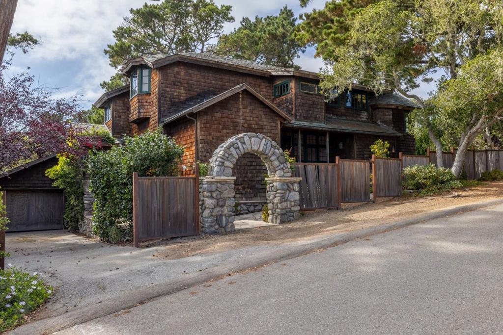 Tucked near Carmel's Forest Theater, this 2,500 square foot home offers 4 bedrooms and 3.5 baths on an 11,400 square foot lot. Enjoy filtered ocean peeks and the warmth of a classic Carmel stone fireplace, the true centerpiece of the home. Originally built in 1924 and updated in the 1980s by local artisan Drew Jensen, this property showcases wood milled right on site and timeless stonework by the DeMaria family, reflecting the artistry Carmel is known for. While the home is ready for thoughtful updates and a fresh vision, it offers incredible potential to be re-imagined into something truly special. With its prime location so close to Carmel's beaches, shops, and restaurants, this property combines character, history, and opportunity in one of Carmel's most desirable neighborhoods.