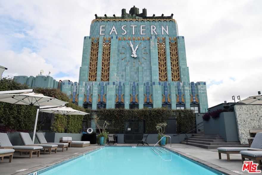Beautiful loft at the historic Eastern Columbia building. Polished concrete floors with full southern exposure views. This is an open floor plan with a dedicated bedroom area, ready for flexible use and creative configurations. The kitchen includes shell stone counters and stainless steel appliances. The large bath features a deep soaking tub. Enjoy all the building has to offer, including the regal lobby, beautiful rooftop pool, spa, fireplace, and lounge area, wifi, Zen garden, workout room, front desk staff, and on-site property manager. Sitting at the corner of South Park, the Fashion District, and the Historic Core, the Eastern Columbia Lofts is directly across the street from The Orpheum Theater and a short distance from boutiques and cafes.