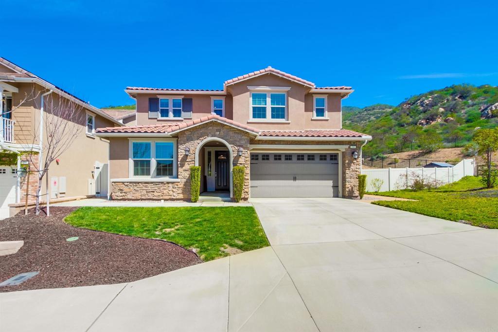 Presenting a HOME and a neighborhood for the whole family! FULLY PAID solar! Double LOT! Direct bath access from every bedroom! HUGE garage! NO neighbors behind! No matter what your favorite activities are, the good life begins in this beautiful 3,373 sqft. 4 bed/3.5 baths home with fully paid solar situated on a double lot (appx. 1/4 Acre) in the beautiful and active Promontory at Horse Creek Ridge as the last home at the top end of a double cul-de-sac street. The expansive lot provides room to build a pool and still have a backyard. Beat your coworkers home with an improved commute, park dirtbikes in the 3-car tandem garage, walk directly to hiking trails, create culinary masterpieces in the spacious kitchen or built-in backyard BBQ, or just step out to your California Room to enjoy a glass of wine as the Fallbrook sky is painted with pink hues of sunset over the picturesque hills with no neighbors behind you. The heart of this home is the great room with spacious kitchen cabinetry (including walk-in pantry) and family room, double and single sliding glass doors to provide warm-tone sunlight and connect you with the California Room; backyard, dramatic center continent with seating for 5 and topped with the most beautiful granite slab you've ever seen. The luxurious primary suite features a designer's dream bathroom with expert tile work throughout, walk-in shower (tiled floor to ceiling), soaking tub, separate vanities, and a 2-door passthrough closet that will accommodate any wardrobe. 2 upstairs secondary bedrooms are separated by a jack-n-jill bathroom. The downstairs guest suite provides total privacy, nicely separated from the 3 bedrooms and bonus room (which could easily be converted to a 5th bedroom) upstairs. An open office downstairs could have unlimited uses. The whole house fan helps to keep your home cool in the summer. The commuter-friendly location provides quick access to both the 15 and 76. Jump off the freeway in the afternoon right before the daily commute does its worst to your nerves heading into South Riverside County. Enjoy the efficiency, luxury and convenience of a newer home without the inconvenience and expense of installing window treatments or having your backyard landscape designed and executed in this spacious and gorgeous home for the whole family. Other home features that you'll love: Dramatic high ceilings; Wide hallways; Downstairs office (could be converted to 5th bed/expanded guest suite); Tandem 3-car garage; Fully paid solar; Downstairs guest suite; Enormous upstairs bonus room and laundry; Wood grain LVP flooring with 5.5-inch baseboards; Low-maintenance landscaping; Built-in BBQ; Expansive back patio; Abundant storage spaces; Whole-house fan; In-wall pest control system.