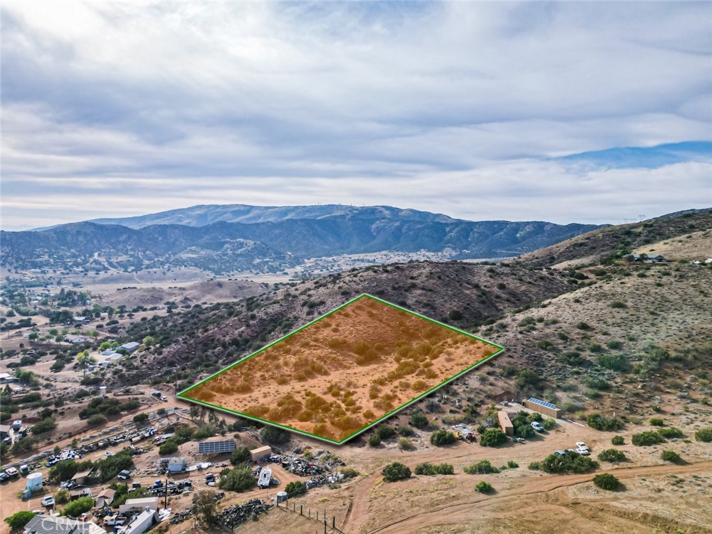 An Exceptional Opportunity to Own a Stunning Lot in Acton! This expansive 117,002-square-foot property offers breathtaking views of the surrounding hills and valleys, embracing California’s natural beauty at its finest. Power is conveniently available nearby, making development seamless. Nestled just minutes from downtown Acton, this property combines peaceful privacy with easy access to local amenities. Whether you envision a unique development opportunity, a serene desert retreat, or the perfect spot to build your dream home, this versatile lot is brimming with potential. Don’t miss the chance to own your own piece of California’s high desert paradise!