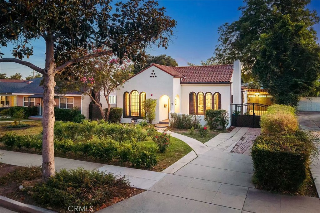 Welcome to this beautifully updated Spanish-style residence located in the sought-after North Alhambra neighborhood. It blends timeless architecture with modern comfort, featuring 4 bedrooms and 4 bathrooms. Inviting curb appeal with a classic red Spanish tile roof and lush green front lawn. The welcoming front porch adds warmth and character to this cozy home. The original house has an elegant, light-filled living room with arched casement windows, a charming white brick fireplace with decorative tile inlay, and a wrought-iron chandelier. Formal dining room with arched built-ins, elegant light fixture, and abundant natural light from classic French doors. Bright and inviting kitchen featuring white cabinetry, Quartz countertops, dual pendant lights, and charming mosaic tile accents. Primary bathroom with dual rain shower heads, built-in shower niches, a frameless glass panel, and a built-in bathtub. An additional en-suite bedroom with an updated private bath. The third bedroom is conveniently located near the hallway bathroom. Dedicated laundry room located just off the kitchen.
The newer addition was built in 2018, and can be accessed from the main house or via a separate entrance—ideal for in-law quarters or income potential. Sleek modern kitchen with Quartz countertops, full backsplash, stainless steel appliances, and ample cabinetry. Open-concept living room with built-in desk—perfect for working from home. Private primary suite with French doors to the back deck, walk-in closet, and stylish en-suite bathroom.
Additional Features include: Fresh interior paint and rich hardwood floors throughout most of the home. Long driveway with double gates leading to a detached 2-car garage. Newly installed grass and sprinkler system in the spacious backyard. Updated plumbing, gas pipes, water pipes, sewage pipes, and electrical panel. Bolted foundation. Dual central AC & Heater, tankless water heater. Prime location near shops, supermarkets, and restaurants. Easy access to the 10 Freeway—just minutes from Downtown LA.
