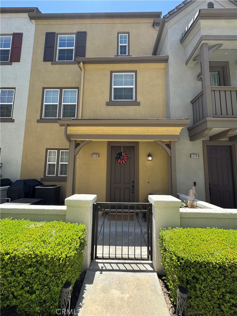 Built in 2006, this well-maintained tri-level townhouse, situated in the sought-after Artisan Collection community, has a living space of 1378 SF, a total of two bedrooms, and two and a half bathrooms. Laminate wood flooring throughout. First floor: an office space with built-in desk and cabinets, a laundry room with washer and dryer, and an attached two-car garage. Second floor: kitchen, great room which seamlessly flows to the gorgeous balcony, one powder room. The third floor has two en-suite bedrooms. Community amenities include a swimming pool, spa, BBQ area, and gym. Convenient Location: easy to access 60, 15, and 71 freeways, close to Home Depot, Shopping Centers, and parks.