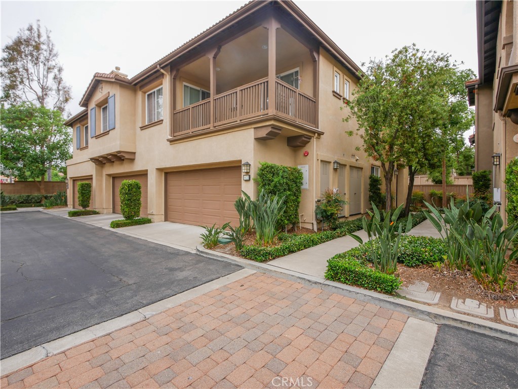 Beautiful home in the GATED Sheridan in West Irvine. Modern 3 beds, 3 bath home. This light-filled home provides an open layout, two-story high ceiling in the living room with a cozy fireplace. The newer remodeled kitchen includes quartz countertops, white cabinetry, refrigerator and plenty of prep space. Dining area opens to the kitchen with a large sliding door leads to the low maintenance yard. There are 2 bedrooms on the second floor and a 1 bedroom with a shower on the first floor. Master suite has a good size walk-in closest with an additional linen closet off the bathroom. Inside laundry room on the main floor with washer and dryer included. Attached 2-car garage. Close walk to the HOA pool and park. It is located near the Tustin Market Place, Peters Canyon Trail, The OC Great Park, and many great restaurants.