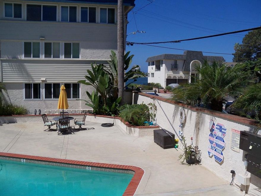 Welcome to your coastal escape .This large 1 bedroom , 1 bath beauty is tucked in a prime west facing Bayfront building on Sail Bay .   Slab granite kitchen and bathroom .   Large bay view patio for BBQ . Large heated  pool in the courtyard . Your own reserved carport # 7 is close by.   Come live the dream on the bay .