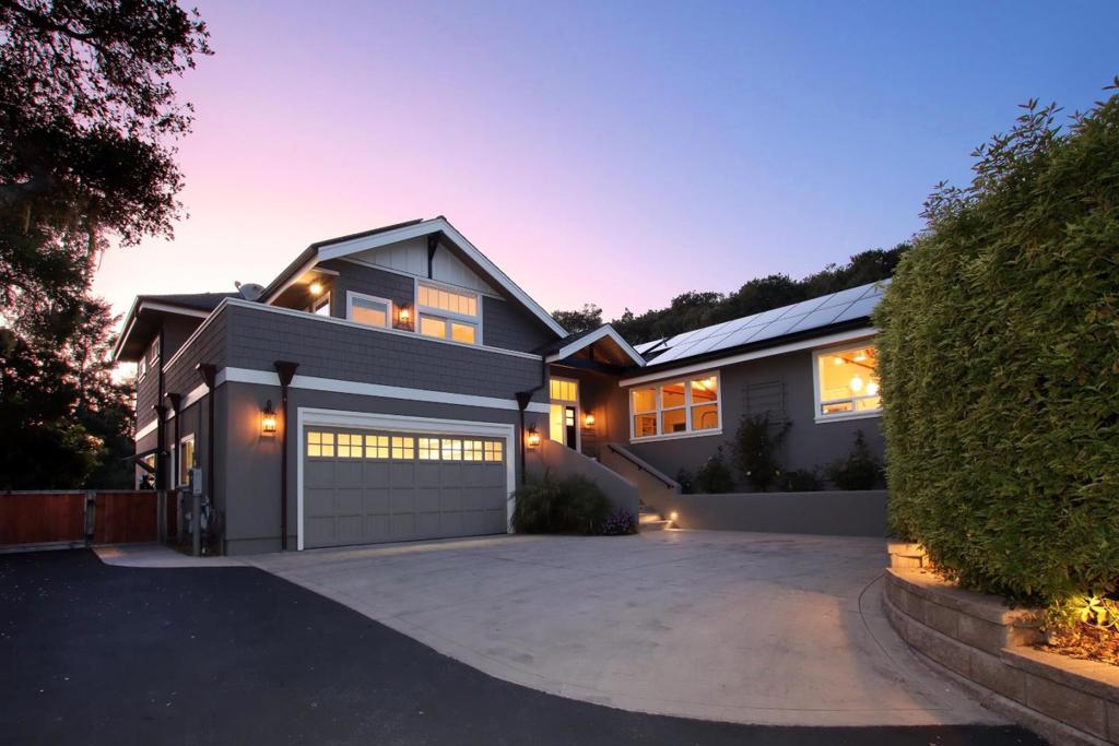 Perched atop a scenic hilltop in Aptos, this stunning Craftsman home offers ocean views and over 3,000 sq ft of beautifully designed living space with custom architectural detail and built-in cabinetry everywhere. The expansive, airy great room flows into the chef's kitchen, equipped with top-of-the-line appliances perfect for both everyday living and entertaining. Three luxurious primary suites with spacious custom closets present versatile spaces for family living, guests, or a home office setup. The open-concept design is enhanced by rich hardwood floors and soaring vaulted ceilings, creating a warm and inviting atmosphere throughout. The large two-car garage connects to a light-filled bonus room ideal for an art studio, home gym, or workshop, and there is ample additional parking for guests. Situated on a full acre, the property is fully fenced with a security gate, offering privacy, a garden for outdoor entertaining, and direct access to nearby trails with room to bring your landscaping dreams to life. Just 1.5 miles to the beach and minutes to shopping and freeway access, this exceptional home offers the perfect blend of tranquility, convenience, and coastal living.
