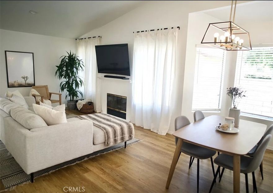Welcome to one of the most unique and desirable homes in Mountain View Courtyards.

This single-story condo stands apart with only one shared wall and no neighbors behind or on either side, offering unmatched privacy. It’s also one of the few units with direct garage access into the home, rather than a separate entry.

Inside, the property has been extensively updated with fresh interior and exterior paint, white and gray quartz countertops, light oak LVP flooring, and sleek black kitchen hardware paired with high-end stainless steel appliances (only four years old). Even more, the home features all-new electrical throughout, recessed lighting, modern light fixtures, and ceiling fans in the bedrooms. The vaulted ceilings and abundance of natural light create an open, airy feel. Additional upgrades include a new water heater and a replaced Rheem AC condenser.

The private backyard is another highlight, complete with a pergola, greenery, and a rare side yard for convenient trash can storage. The exterior and roof were replaced within the last five years, ensuring peace of mind. With one of the larger yards in the community and a prime location at the very first turn for easy access, this home is both practical and special.

Zoned for award-winning Saugus High and just minutes from restaurants and freeway access, this is a standout opportunity at only $246/month HOA — a rare chance to own a private, modern, move-in-ready home in Mountain View Courtyards.
