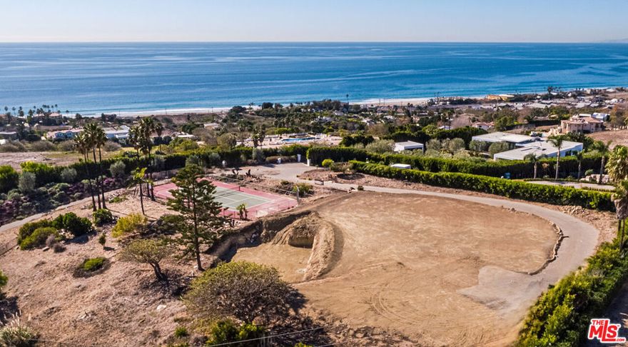 **Permits Approved  Ready to Build Immediately** Seize a rare opportunity to create your dream estate on over 2 private acres in one of Malibu's most coveted locations. Ideally situated just above Morning View Drive and moments from the beach, this premier property offers more than an acre of flat, fully graded land with sweeping 180-degree ocean views.With city permits and thoughtfully designed architectural plans already approved, construction can begin immediately. The envisioned residence features a majority of its living space on the main level, including a grand primary suite, three additional ensuite bedrooms, a formal entry, an expansive great room, a spacious family room, and an open-concept kitchen with a dedicated dining area.The lower level is designed for elevated entertaining, complete with a state-of-the-art screening room and an elegant bar/lounge. A private guest suite with its own balcony occupies the upper level, offering a secluded retreat.Enhancing the estate's appeal is a full-size tennis court in excellent condition an increasingly rare amenity in Malibu. This is an extraordinary chance to build a custom coastal compound with panoramic views and luxury lifestyle potential, all in a prime location.