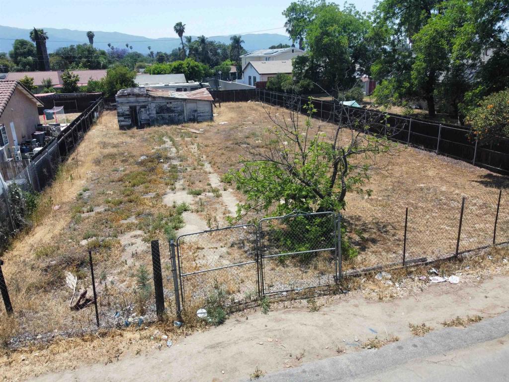 Incredible opportunity to build in a charming, established neighborhood in Corona. This spacious residential lot is zoned R-2, which means it is zoned to build a two-unit multifamily duplex and a possible ADU, but please check with the city for details. Build two units—live in one and rent out the other, or create a multi-generational living space. Located on a quiet street lined with single-family homes, duplexes, and triplexes, the neighborhood offers a welcoming atmosphere just minutes from key conveniences. The property benefits from easy freeway access—both I-15 and the 91 freeway are nearby, making commuting and regional travel seamless. Families will appreciate proximity to Home Gardens Academy (K–8) just 0.4 miles away, and Santiago High School, approximately 3.2 miles from the site. Outdoor enthusiasts will enjoy nearby parks and recreation, including Hidden Valley Nature Center and Louis Robidoux Nature Center within a short drive. Two additional lots are also available from the same owner on the same street—one is zoned R-1 and and the other is zoned R-2 and located a couple parcels away (these two are currently fenced together). Buyers can choose to purchase this lot alone, pair it with either of the other parcels, or acquire all three together to build multiple homes, expand yard space, establish a family compound, or invest for the future. Utilities are nearby and can be easily connected as this is in a residential neighborhood. This represents a rare opportunity to build and invest in an established Corona neighborhood, offering flexibility, access, and long-term potential.