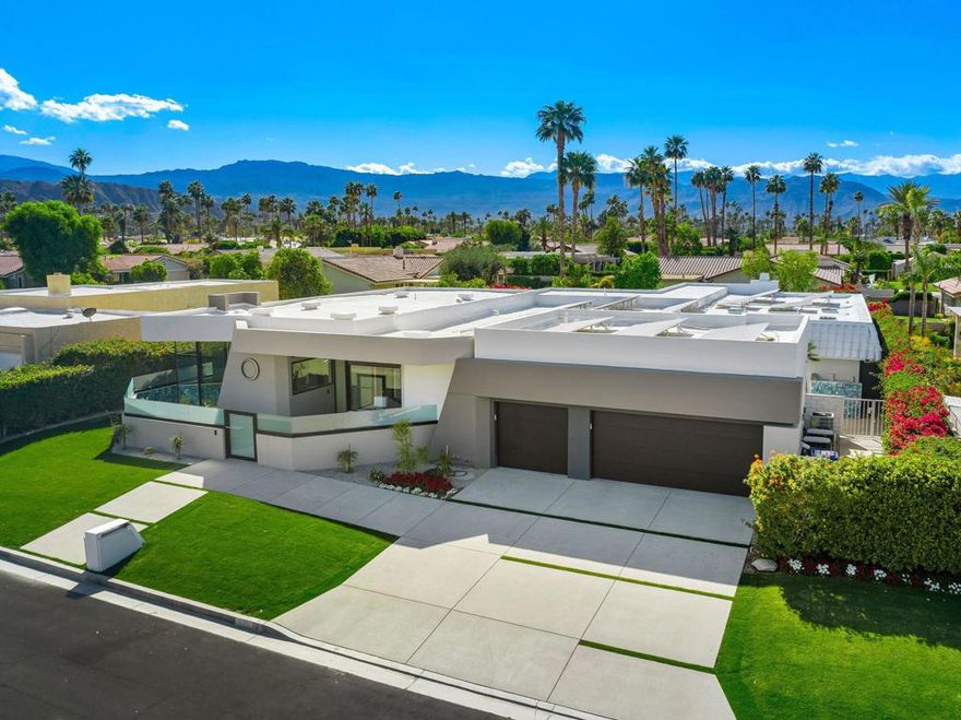 A Modern Sanctuary with Panoramic Views in Indian WellsOffered Fully Remodeled and Designer-FurnishedPerched along one of Indian Wells' most desirable streets, this architecturally reimagined residence offers uninterrupted vistas of Eisenhower Mountain and the surrounding ranges from nearly every room. The home presents a harmonious blend of clean-lined contemporary design and refined comfort, crafted through a meticulous collaboration between architect and interior designer.This four-bedroom, four-bathroom property features a seamless indoor-outdoor flow, where thoughtful design maximizes natural light, privacy, and tranquility. The gourmet kitchen is equipped with a premier appliance suite, complemented by white cabinetry and a generous walk-in pantry. Each bathroom is uniquely appointed with distinctive blue tilework, offering a cohesive yet individual aesthetic throughout.Outdoors, a lushly landscaped backyard sets the tone for elevated desert living--complete with a pristine pool and spa, built-in BBQ, and outdoor shower. The oversized garage with epoxy flooring and built-in storage enhances the property's practical appeal, while two solar systems contribute to sustainability and energy efficiency.Every space within the home is purposefully considered, from the elegantly appointed guest suites--each with a private bath--to the serene owner's suite, all oriented to capture breathtaking mountain views. Whether hosting guests or enjoying a quiet morning coffee, the atmosphere remains one of serene luxury and effortless sophistication.Offered with all new systems, furnishings, and finishes, this is a rare opportunity to own a turnkey property of architectural and aesthetic excellence in Indian Wells.