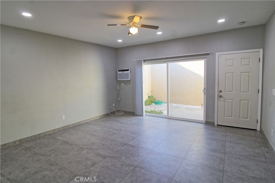 The front courtyard lends just the right amount of extra privacy for this spacious ground level one bedroom, one bath apartment.  Large open living area, cozy updated kitchen with high top bar overlooking eating area.  Updated bathroom with walk-in shower.  Large bedroom features walk-in closet with built-in organizers. Private rear patio area with concrete slab.