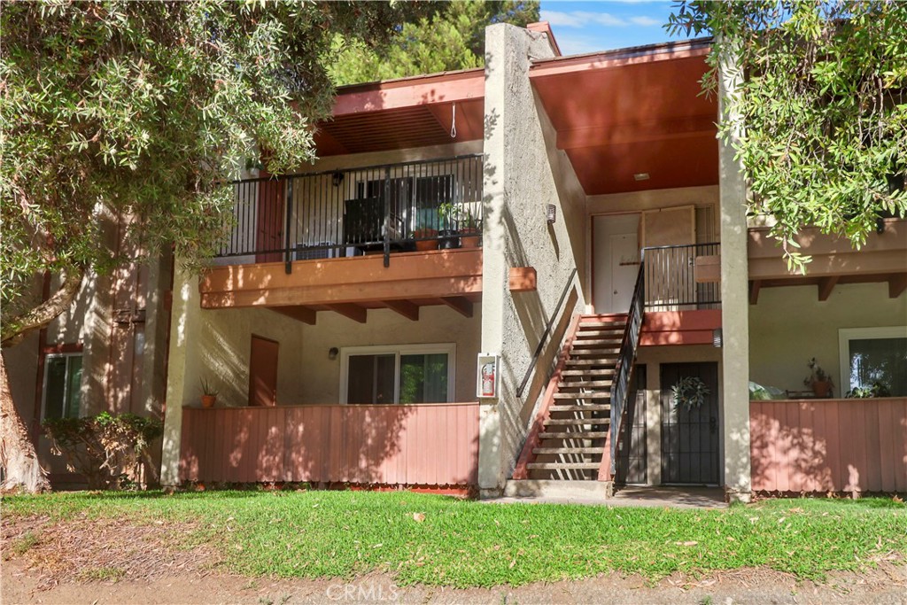 Welcome to Fashion Heights, gated community offering both comfort and convenience. This upper-level condo features approximately 886 sq. ft. of thoughtfully designed living space, including two bedrooms and two full bathrooms. The remodeled kitchen with quartz countertops seamlessly connects to the open-concept living area, which extends to a private balcony—perfect for outdoor dining or weekend barbecues. Additional highlights to the unit which include a detached two-car garage and easy access to the community’s sparkling pool just steps away. Fashion Heights community ideally located near local shopping, dining, and Vista Grande Park, and offers the perfect balance of lifestyle and convenience.