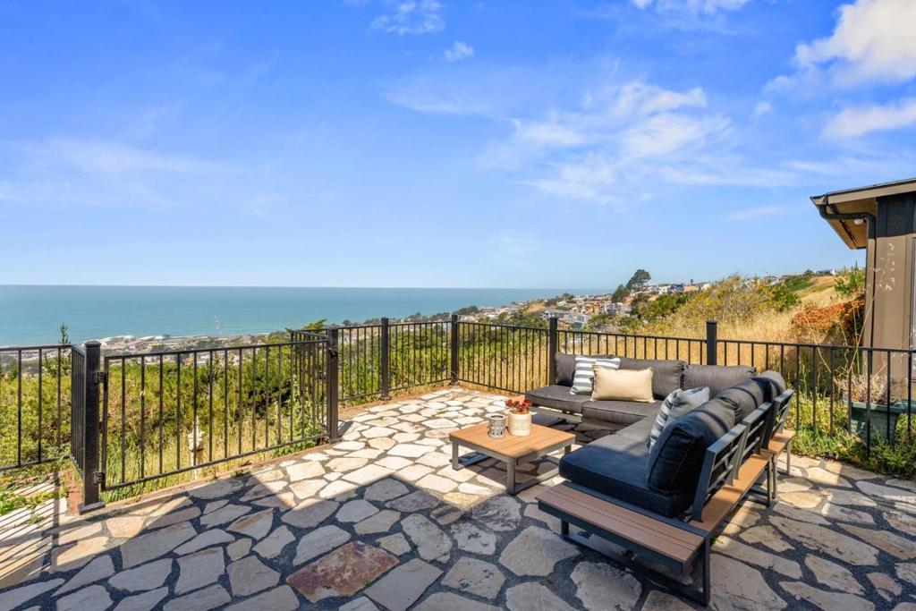 Views Views Views...Did we say Views? Modern 2-Bed, 2.5-Bath Townhouse with Ocean Views & Prime Location. Discover contemporary coastal living in this beautifully updated 2-bedroom, 2.5-bath townhome spanning 1,440 sq. ft. across two stylish levels. Thoughtfully designed for comfort and convenience, this home features an open-concept layout with fabulous natural light and two large private fenced in patio areas perfect for family gatherings and enjoying the stunning ocean views. The modernized kitchen boasts an abundance of sleek new cabinetry with elegant countertops, stainless steel appliances; flowing seamlessly into the spacious living and dining areas. Downstairs, the primary suite offers a serene retreat with ocean views. There is ample closet space and updated primary bath. A well-appointed updated second bathroom and second bedroom provides flexibility for guests or a home office. Also included is an updated 1/2 bath, fireplace, inside washer & dryer, and oversized 2 car garage. The HOA enjoys two shared pools! Ideally situated near shopping, SFO, and major transportation hubs including Highway 101, I-280, BART, and SamTrans this home offers both urban accessibility and a tranquil coastal vibe.
