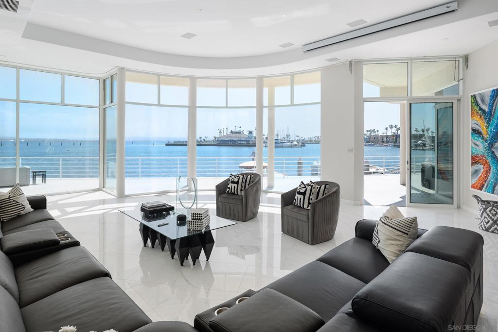 THE NICEST HOME IN THE BEST LOCATION IN THE CORONADO CAYS! Rarely available approximately 132' of south facing waterfront with incredible panoramic bay, mountain and city views! Boasting over 11,000 square feet of wharfage. No less than four boat slips where you can park your large catamaran along with your yacht, speed boat and water toys. Exclusive architecturally designed and impeccably updated. Kitchen remodeled with new high-end appliances. His and her bathrooms in primary bedroom. All ensuite bedrooms with balconies. New stone and engineered hardwood floors. New stone fireplace. Refurbished dock. New ACs. New roof gutters. LED lighting. Move in ready! Don't miss this once in a lifetime chance to own the most exquisite home on the water on San Diego Bay!