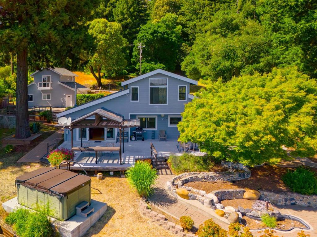 Top of the World Homesteaders Paradise in Aptos - Ocean and Mountain Views. Welcome to your dream retreat in the sky. With panoramic views of the Pacific Ocean and the Santa Cruz Mts.,this exceptional property offers a blend of serenity, self sufficiency and modern comfort. The main home features 3 spacious bedrooms and 3 full bathrooms. Natural light floods every room, enhancing the views and creating a tranquil ambiance. Whether relaxing in the great room or cooking in the open concept kitchen you'll feel completely immersed in nature. A permitted 1 bedroom ADU provides additional living space for guests, multigenerational living or rental income. Complete with kitchen, full bath, bedroom and private entrance. Set on 4.7 acres, though not off grid, it's outfitted for off grid living and sustainability: private well, multiple water storage tanks, owned solar power system, back up generator, three car garage, swim spa, usable land for gardening, livestock, orchards or expansion. Enjoy total privacy while still being minutes from Aptos Village, beaches and the conveniences of town. Whether you're an aspiring homesteader, nature lover or someone simply seeking a peaceful escape, this is more than a home - its a lifestyle. Live sustainably. Live beautifully. Live above it all.