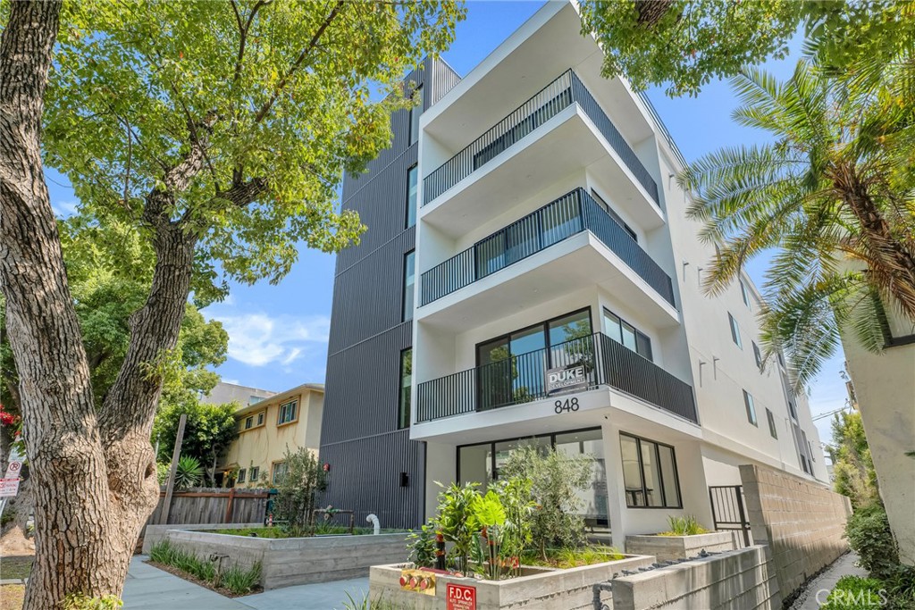 Stunning New Construction Penthouse with Panoramic Views! Be the first to live in this brand-new, ground-up construction—a true showstopper located near The Grove, offering breathtaking views of downtown LA and the Design District. This two-bedroom, two-bath penthouse boasts soaring high ceilings, modern finishes, and a spacious open floor plan flooded with natural light. Step into a designer chef’s kitchen featuring custom quartz countertops, a large island with bar seating, stylish backsplash, and brand-new stainless steel Frigidaire appliances—including a refrigerator, stove, dishwasher, and built-in microwave. Both primary suites are generously sized with walk-in closets and spa-inspired en-suite bathrooms adorned with custom tile work and elegant vanities. Enjoy breathtaking views from every room and access to a large wrap-around private patio, perfect for entertaining or unwinding while taking in the cityscape. Additional features include: In-unit washer and dryer, Central A/C Two side-by-side parking spaces, with elevator and stair access
This penthouse combines luxury living with unmatched convenience in one of LA’s most sought-after neighborhoods. Don’t miss this rare opportunity!