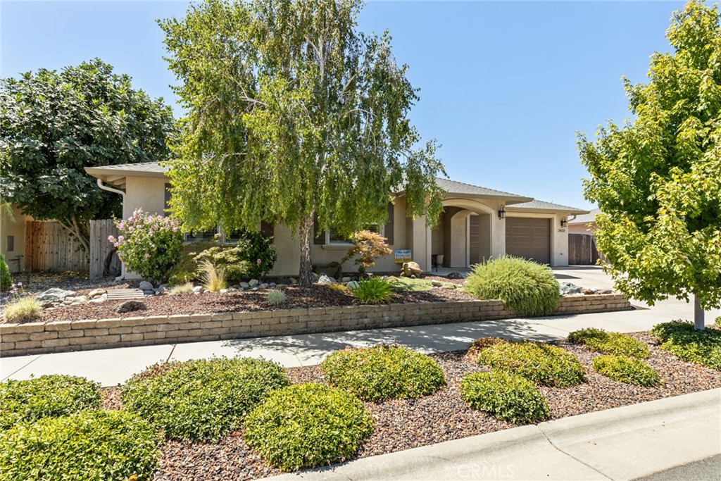 Welcome to 3439 Bamboo Orchard, a beautifully maintained home in a desirable North Chico neighborhood near DeGarmo Park. Thoughtfully designed inside and out, this property offers owned solar, RV parking with electrical hookup, and a 3-car garage with a tandem bay converted into the ultimate man cave/shop—complete with workbench, cabinets, and utility sink. A storage shed, raised garden beds with irrigation, and meticulously landscaped front and back yards with concrete mow strips add both beauty and practicality. The sellers have also added an extended covered patio, plus a hot tub and natural gas BBQ that can stay for the next owner to enjoy. Inside, you’ll find vaulted ceilings, recessed lighting, and wood-look tile flooring throughout the living spaces, with carpet in the bedrooms. The kitchen features granite counters, an island with eating bar, stainless steel appliances, a pantry, and a refrigerator included. Additional conveniences include inside laundry with sink (washer, dryer, and extra fridge included), abundant storage, and ceiling fans indoors and on the patio. The hall bath offers tiled counters and shower surround, while the spacious primary suite boasts vaulted ceilings, a walk-in closet with built-in organizer, dual sinks with tile counters, and a walk-in tile shower. With thoughtful details inside and out, this home is designed for both easy living and entertaining—an exceptional opportunity in North Chico.