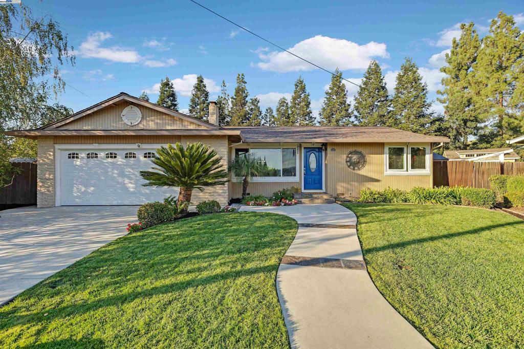 Dazzling Dogwood! Welcome home to this spacious 2-bedroom, 2-bath single-story home on a premium cul-de-sac lot in the desirable Sunny Glen 55+ community. Enjoy a expansive private backyard with lush lawn, sheds, patio, blooming flowers, garden areas, raised planting beds with herbs and a variety of producing plants with room for more. Inside, the home has been thoroughly updated with no detail spared. The kitchen shines with slab granite counters, a gas range, and a lovely enameled cast-iron sink. The living and dining rooms are open and inviting, crowned with classic moulding and featuring an electric fireplace with cozy charm. Don't miss the sparkling upgraded bathrooms and custom lighting. Enjoy the oversized two-car garage which provides ample room for vehicles, hobbies, and extra storage. From its spotless interiors to its excellent curb appeal, this home is move-in ready and waiting. Hurry! Open Thursday 9/18 10-1 and Sat/Sun 9/20-21 from 1-4