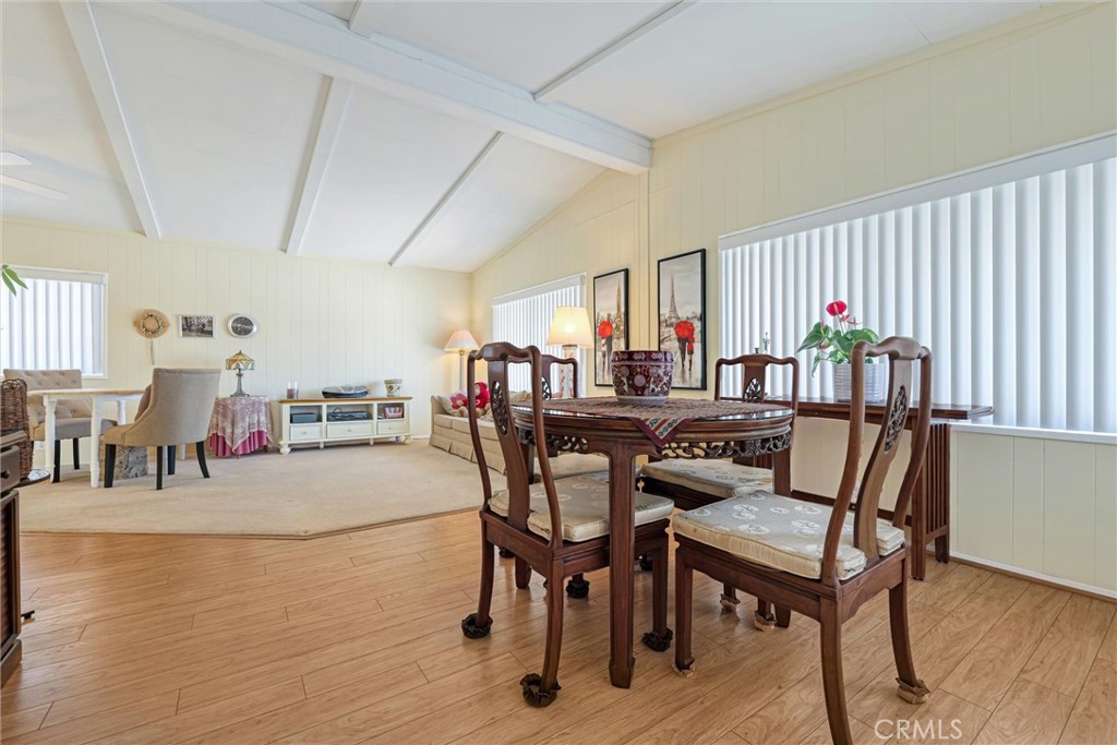 This Gorgeous 1977 Mobile Home is full of lots of space, 1200 sq ft, 3 Bedrooms , with one bedroom if preferred, that can be also be used as a sunroom at the entrance, 2 Full Bathrooms, lots of upgrades and that modern and cared for touch is abound everywhere! Oak Pine Flooring, with special Maple Flooring in the kitchen, giving it that lovely glow as you glide through the home. The Master Bedroom has ample Closet space with shelves inside, carpeting for warmth, and is connected to a large full sparkling bathroom with lots of light and handrails in the tub/shower for your safety and comfort. The second bedroom is also very roomy with lots of light and has an adjoined full bathroom that has a door to the laundry room with another side exit door wih full steps and rails. The kitchen has plenty of table and serving space and is enveloped and private from the rest of the house. All the modern conveniences are closeby for daily meals preperation and sit down comfort! Around the corner from the kitchen is the small dining room area, with table and chairs room and with lots of built-in cabinet space for all your treasures to display and for all of your filing needs. The dining room then invites you to the huge Living room and Full Dining room for lots of invited guests to enjoy and for your entertaining them comfortably! The home is located near the pool, but far enough away to not hear the sounds emmitting from the Pool, Clubhouse or the Pacific Coast Highway street traffic.. This is a Gem that is calling you to make it Your Own!