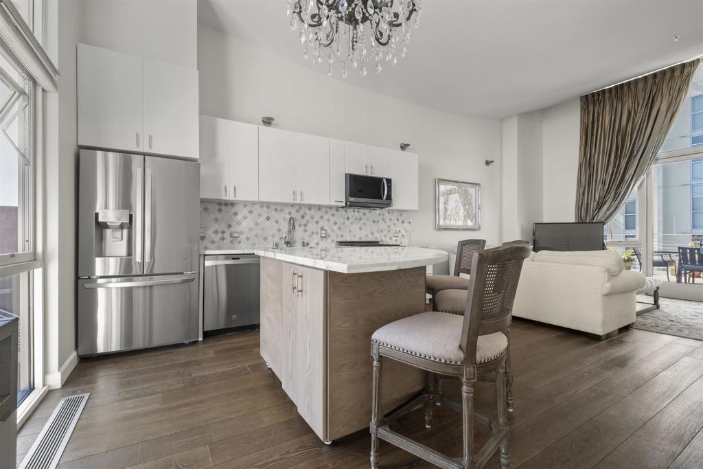 Beautifully remodeled, light-filled condo in Hillcrest! This stylish two-story unit features a brand-new designer kitchen with a movable island, stainless steel appliances, and elegant marble countertops. It offers two spacious bedrooms, two bathrooms, in-unit laundry, and convenient storage under the staircase, all on the first level. Upstairs, the open-concept kitchen, dining, and living area flow seamlessly onto a generous 300-square-foot terrace—perfect for entertaining or relaxing. The condo also includes 2 tandem parking spots as well as a nice-sized storage unit in the parking garage. Whether you're a passionate cook or a plant lover, or just a lover being walking distance to everything, this home invites you to make the most of indoor-outdoor living. The condo is located on Park Blvd. Only a short walk to the San Diego Zoo, Balboa Park, and much more.