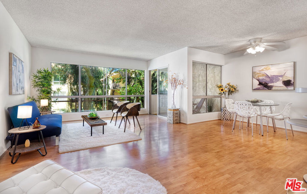 Beautiful and serene 2 bedroom + 2 bathrooms + 1 covered balcony + 2 side by side parking spaces + corner unit! HOA includes many utilities: Internet, cable, earthquake insurance, water (hot and cold), sewer and trash! Open floor concept, very spacious, light, bright and airy living area w/ breakfast bar and dry bar w/ wine rack. Large windows in the living room brings natural light with the view of the courtyard and tree top. Covered balcony flows from the living area and it is a peaceful spot to have a glass of wine or cup of tea/coffee. This Covered Balcony can also be easily converted to a Den by enclosing w/ a window (has to follow the HOA rules and other people in the complex have done it), it is an option for people that need an extra bonus room/Den/office space for working/studying from home. Great functional kitchen with lots of storage. Hallway bathrooms has remodeled shower. Large master bedroom w/ large walk in closet. Great size second bedroom. Camelot is designed in such a way that it is ideal for Sunny California weather. It takes advantage also of the ocean breeze. The entire complex has no closed hallways, there are breezeways instead. Open the door and windows and there is a natural breeze providing great cross ventilation. For the few times that it rains, don't worry about it! The architects thought about that too! It is designed in such way that each unit can get to the elevator without getting wet! Complex offers great amenities: Pool, spa, sauna, party room, billiards room, exercise room, putting green, BBQ areas. There is a great park across the complex: Jogging/exercise path, tennis and paddle tennis courts, playground, green area, Basketball hops, Volleyball, and more. Award wining k-12 schools! Centrally located in the west side, close to Silicon Beach areas, Playa Vista, LAX, Santa Monica, Beaches, shopping mall, all kinds of retails, restaurants, and Fwys.